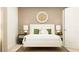 Stylish bedroom featuring a plush bed with decorative pillows, and decorative lighting on side tables at 2340 Treaty Ln, Douglasville, GA 30135