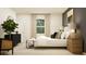 Well-lit main bedroom with modern decor and ample natural light from a large window at 2340 Treaty Ln, Douglasville, GA 30135