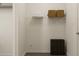 Simple closet with shelving, storage and a laundry bin at 2340 Treaty Ln, Douglasville, GA 30135