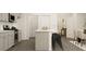 Modern kitchen with an island and bar seating at 2340 Treaty Ln, Douglasville, GA 30135