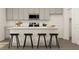 Modern kitchen with stainless steel appliances and an island with bar stools at 2340 Treaty Ln, Douglasville, GA 30135