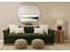 Stylish living room with a green sofa and a large mirror at 2340 Treaty Ln, Douglasville, GA 30135