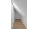 Finished attic space with light hardwood flooring and modern lighting fixtures at 2631 Sardis Way, Buford, GA 30519