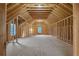 Spacious unfinished attic featuring exposed framing and natural light from windows at 2631 Sardis Way, Buford, GA 30519