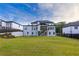 Expansive backyard with lush green lawn, perfect for outdoor activities, and a modern home exterior at 2631 Sardis Way, Buford, GA 30519