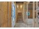 Unfinished basement with exposed framing and a staircase leading to the upper level at 2631 Sardis Way, Buford, GA 30519