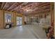 Unfinished basement with concrete floor, wood-framed walls, and natural light from the windows and doors at 2631 Sardis Way, Buford, GA 30519
