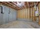 Unfinished basement space with exposed insulation, concrete walls, and rough-in plumbing, ready for customization at 2631 Sardis Way, Buford, GA 30519