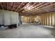 Large unfinished basement with exposed wood framing and concrete floor, offering ample space for future expansion at 2631 Sardis Way, Buford, GA 30519