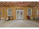 Unfinished basement space with visible framing and double doors leading to the outside at 2631 Sardis Way, Buford, GA 30519