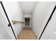 View of basement stairs from the doorway, showing wood stairs with railing leading down at 2631 Sardis Way, Buford, GA 30519