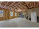 Partially finished basement space with concrete floors and framed walls, ideal for storage or a workshop at 2631 Sardis Way, Buford, GA 30519