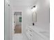 Modern bathroom featuring dual vanity, sleek mirrors, and stylish fixtures at 2631 Sardis Way, Buford, GA 30519