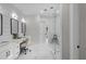 Bright bathroom with double vanities, shiplap walls, glass-enclosed shower, and stylish fixtures at 2631 Sardis Way, Buford, GA 30519