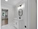 Updated bathroom features modern lighting, a vanity with storage, and neutral color scheme at 2631 Sardis Way, Buford, GA 30519