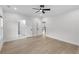 Bright bedroom with modern ceiling fan, hardwood floors, and neutral paint at 2631 Sardis Way, Buford, GA 30519