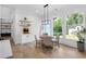 Charming dining area with large windows, modern lighting, and a cozy seating arrangement at 2631 Sardis Way, Buford, GA 30519
