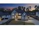 Elegant two-story home with modern architectural details and manicured front yard, showcasing sophisticated curb appeal at 2631 Sardis Way, Buford, GA 30519