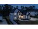 Elegant two-story home featuring a well-maintained lawn, tasteful landscaping, and a sophisticated exterior color scheme at 2631 Sardis Way, Buford, GA 30519