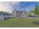 Stunning two-story home featuring a manicured lawn and lush landscaping at 2631 Sardis Way, Buford, GA 30519