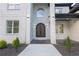 Elegant front entrance with an arched entryway and wrought iron doors at 2631 Sardis Way, Buford, GA 30519