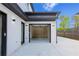 Bright and spacious garage with built-in shelving, complemented by a well-maintained driveway and landscaping at 2631 Sardis Way, Buford, GA 30519