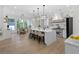Gourmet kitchen with a center island, pendant lighting, stainless steel appliances, and breakfast nook at 2631 Sardis Way, Buford, GA 30519