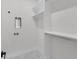 A spacious laundry room with shelving and tile floors at 2631 Sardis Way, Buford, GA 30519
