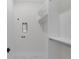 Bright laundry room boasts tile floors, white walls, and a large storage space with built in shelving at 2631 Sardis Way, Buford, GA 30519