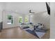 Bright living room featuring modern wainscoting, recessed lights and large windows at 2631 Sardis Way, Buford, GA 30519