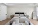 Beautiful bedroom features decorative wall trim, tray ceiling, and plenty of natural light at 2631 Sardis Way, Buford, GA 30519