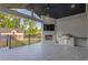 A covered patio is great for entertaining with a built-in grill, fireplace, and TV at 2631 Sardis Way, Buford, GA 30519