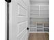 Walk-in pantry featuring custom shelving and ample storage space at 2631 Sardis Way, Buford, GA 30519