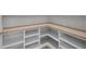 Well-organized pantry with corner shelving and ample storage space at 2631 Sardis Way, Buford, GA 30519