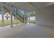 Spacious outdoor patio underneath the deck with a brick wall and concrete floor at 2631 Sardis Way, Buford, GA 30519