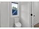 Clean and bright half-bathroom with modern toilet and natural light at 2631 Sardis Way, Buford, GA 30519
