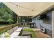 Inviting back deck with patio furniture, grill, and tv at 735 Poplar Rd, Dallas, GA 30157