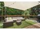 Relaxing back deck with outdoor seating and shade sail at 735 Poplar Rd, Dallas, GA 30157