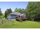Back of house features a deck and fenced in yard at 735 Poplar Rd, Dallas, GA 30157