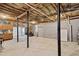 Unfinished basement with concrete floors and exposed ceiling at 735 Poplar Rd, Dallas, GA 30157
