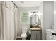 Cozy bathroom features a vanity, toilet, window, and shower at 735 Poplar Rd, Dallas, GA 30157