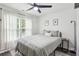 Bedroom featuring a queen-sized bed with a patterned rug and natural light at 735 Poplar Rd, Dallas, GA 30157