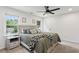 Bright bedroom with ceiling fan, plush carpet and a large window at 735 Poplar Rd, Dallas, GA 30157