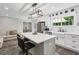 The stylish kitchen features a white subway tile backsplash, island with seating and stainless fridge at 735 Poplar Rd, Dallas, GA 30157