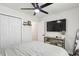 Bright main bedroom features a ceiling fan, closet, TV, and decor at 735 Poplar Rd, Dallas, GA 30157
