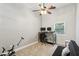 Home office setup with desk, chair, and seating area at 735 Poplar Rd, Dallas, GA 30157