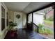 Relaxing back porch with dark flooring and a view of the yard and surrounding greenery at 791 E Main Street, Canton, GA 30114