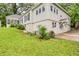 Home exterior with grassy backyard, featuring a patio and access to the basement, perfect for outdoor activities at 791 E Main Street, Canton, GA 30114