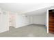 Open basement area with stairs and doorway to an adjoining utility space at 791 E Main Street, Canton, GA 30114