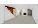 Spacious basement with fireplace, wood staircase, and neutral flooring at 791 E Main Street, Canton, GA 30114